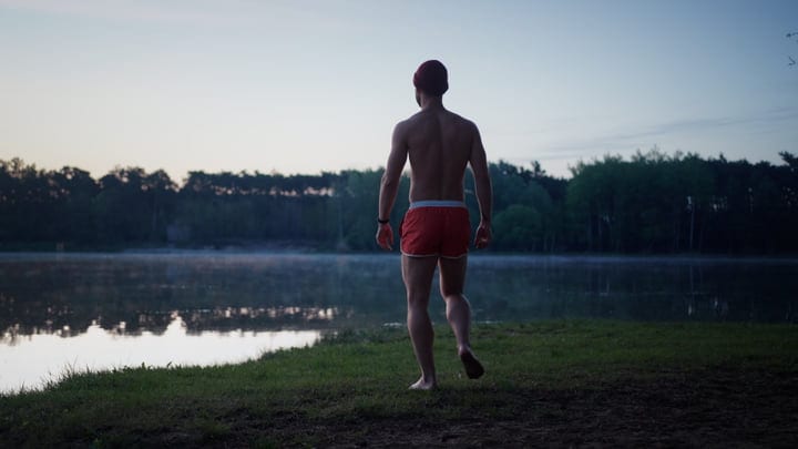 Man Bracing For A Cold Morning Lake Swim