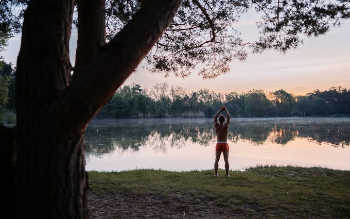 Morning Ritual Of A Man By The Tranquil Lake