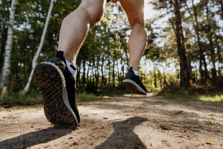 Dynamic Leap Through Forest Trail In Morning Light