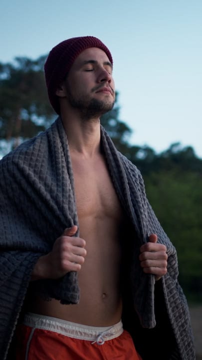 Man Embraces the Chill After Cold Water Swim