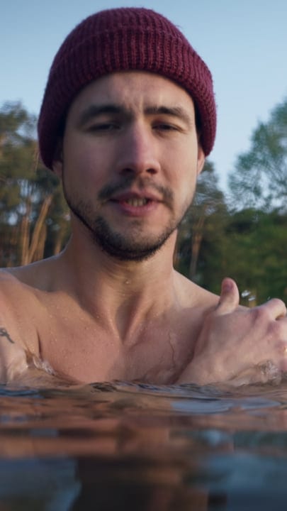 Courageous Plunge: Man Embraces Cold Lake Swim
