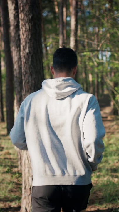 Determined Man Prepares For Cold Water Swim In Forest