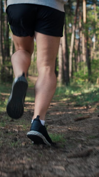 Morning Jog Through Sunlit Forest Paths