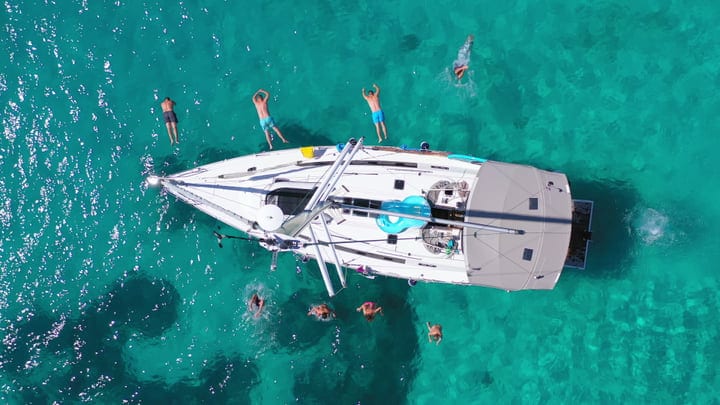 Sailboat Adventure In Luminous Turquoise Waters