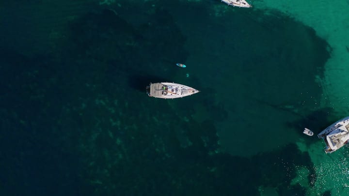Elegance of Sailboats in Serene Turquoise Bay Waters