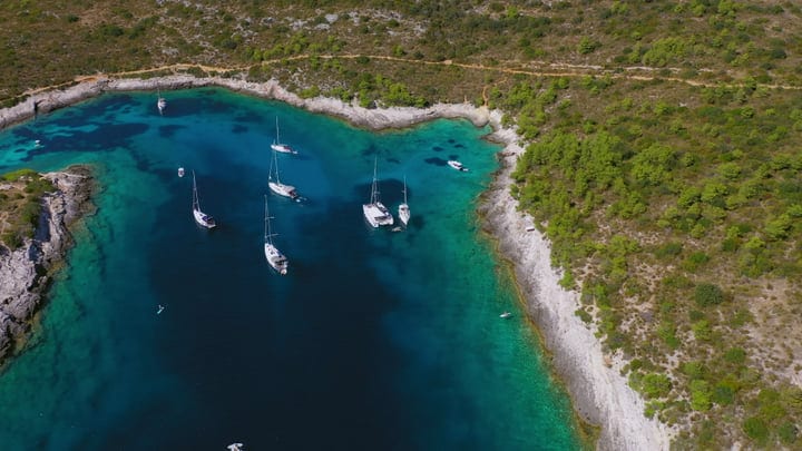 Serene Sailboats Resting in a Turquoise Mediterranean Bay