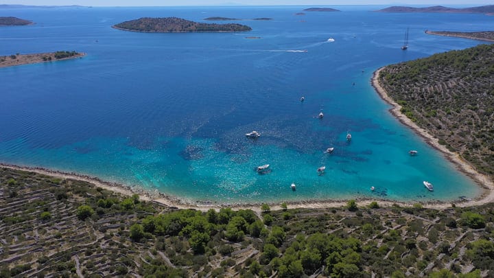 Sailboats Drift Serenely in a Turquoise Bay