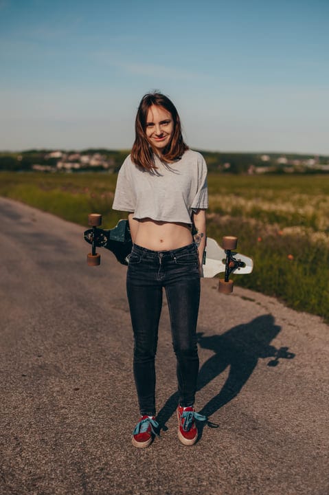 Carefree Skater Enjoys a Sunny Day on Country Road