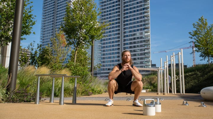 Focused Athlete Prepares for Workout in Urban Setting