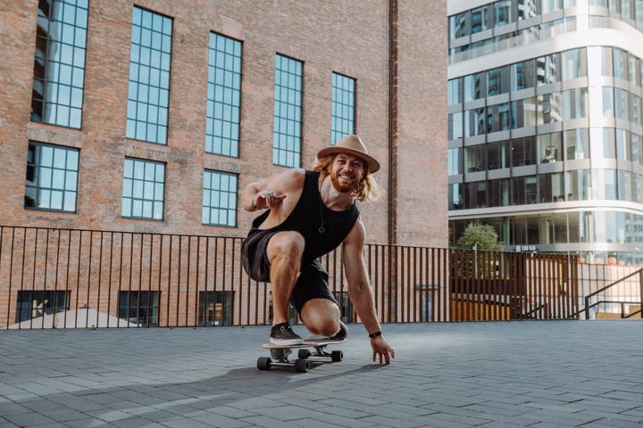Joyful Skater Embraces the Urban Sunset Vibe