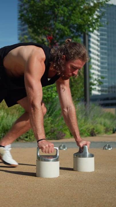 Focused Athlete Strengthens Core in Urban Setting
