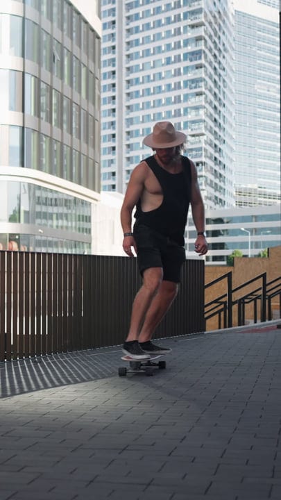 Skater Glides Through Urban Landscape at Dusk