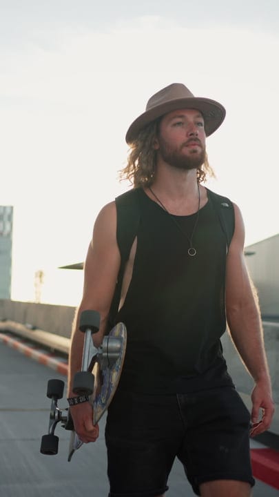 Skater Embraces The Urban Sunset With Confidence