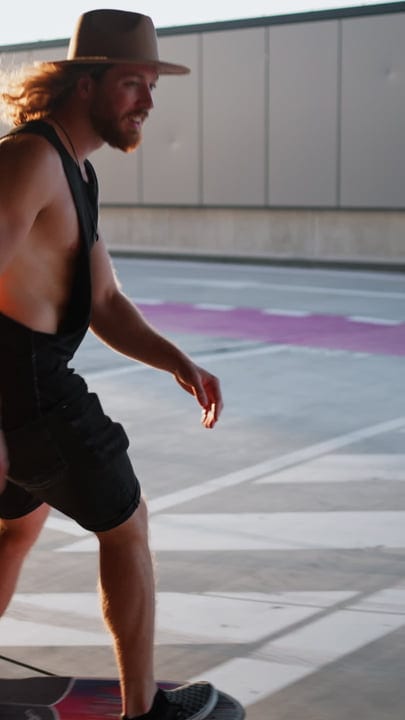 A Skater Glides Effortlessly Through Urban Sunset Hues