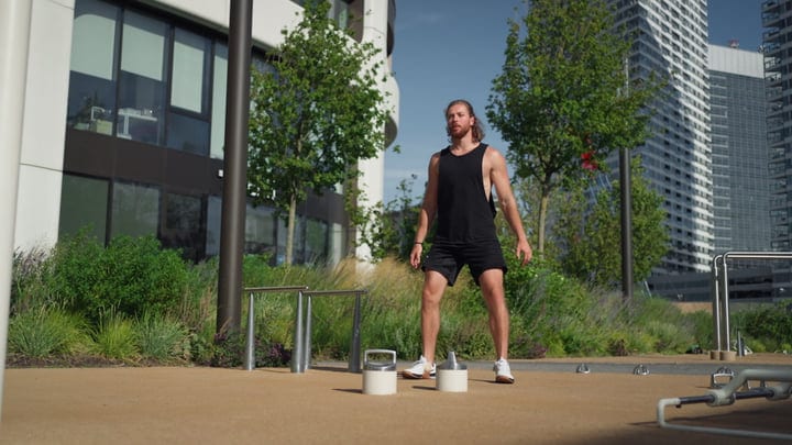 Urban Skater Prepares For Sunset Ride Amid Cityscape