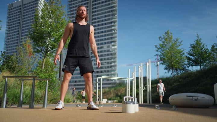 Urban Fitness Enthusiast Prepares for Kettlebell Workout