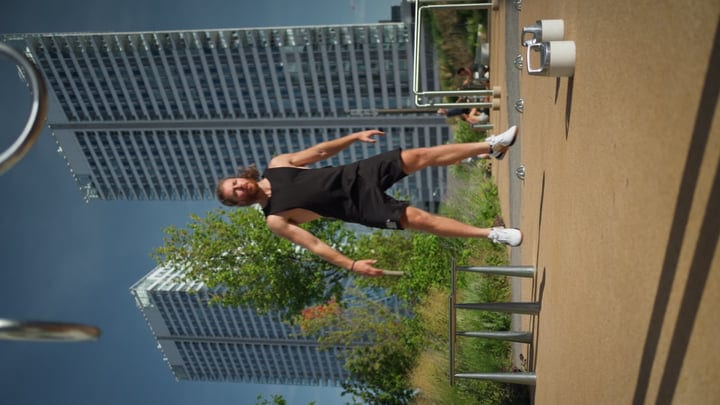 Dynamic Skater Balancing Against a Towering Cityscape