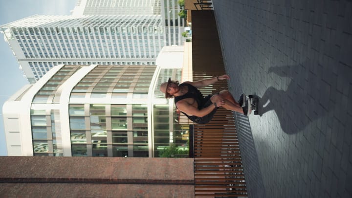 Urban Skater Conquers Cityscape At Sunset Glow