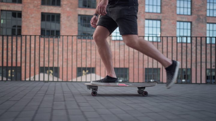 City Skater Glides Effortlessly Across Urban Balcony