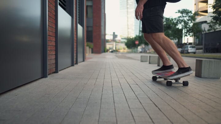 Skater Glides Effortlessly Through City Streets at Dusk