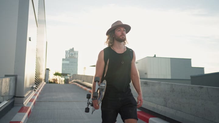 Urban Skater Embraces Sunset Vibes On Rooftop Path