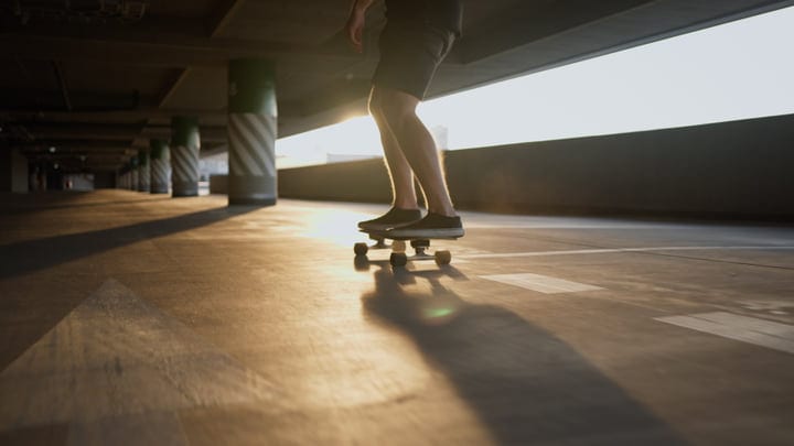 Silhouetted Skater Glides Through Golden Urban Light