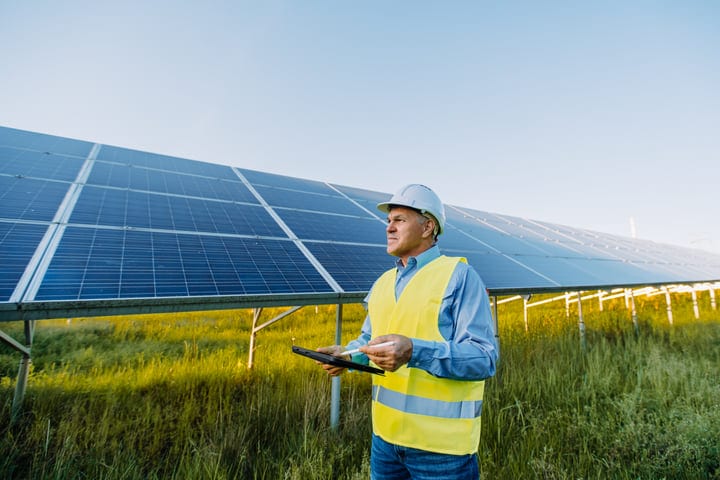 Engineer Conducts Solar Panel Inspection At Sunrise
