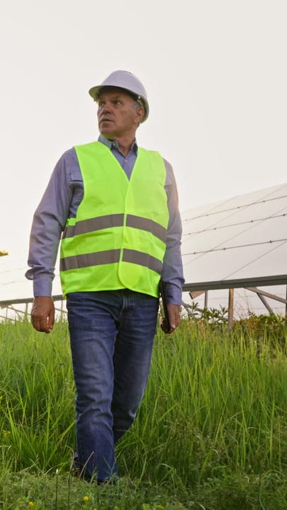 Engineer Walks Through Solar Field With Purpose