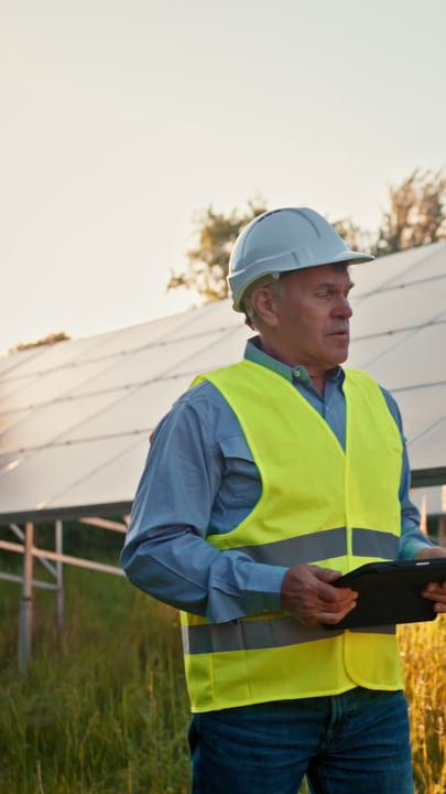 Solar Engineer Conducts Thorough Inspection At Sunrise