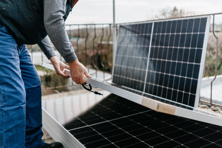 Hands-On Precision With Solar Panels On Rooftop