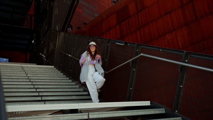 Urban Dancer Descends With Rhythmic Precision On City Stairs