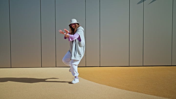 Street Dancer Embraces the Rhythm on Urban Stage