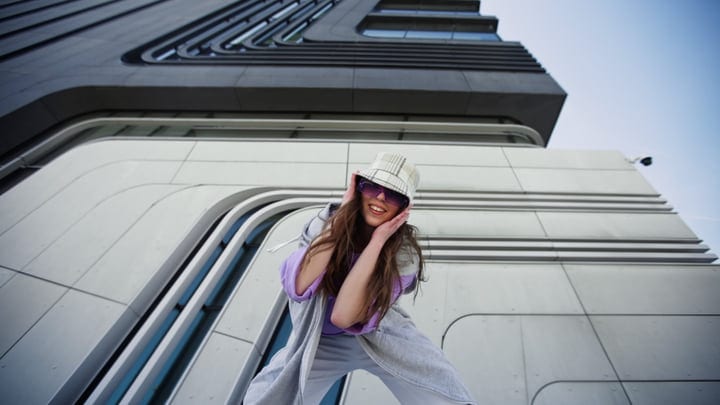 Street Dancer Radiates Joy Against Modern Architecture