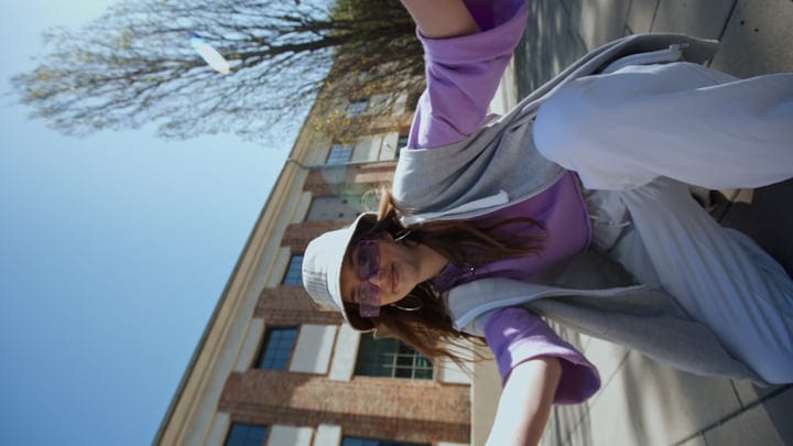 Joyful Street Performer Dancing Under Blue Skies