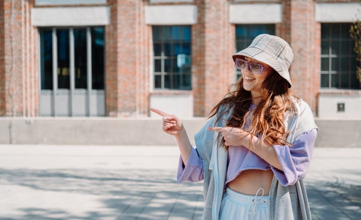 Sunlit Street Dance Pose Captured in Urban Setting