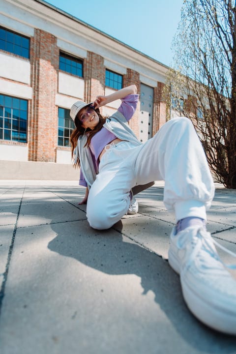 Street Dancer Strikes A Dynamic Pose In Spring Sunlight