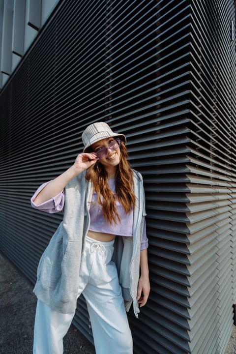 A Street Dancer Poses Against Urban Architecture