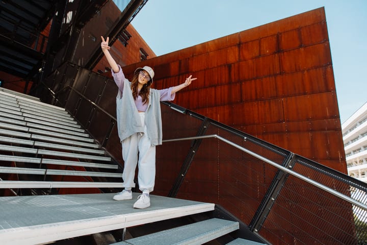 Joyful Street Dancer Embraces the Urban Staircase