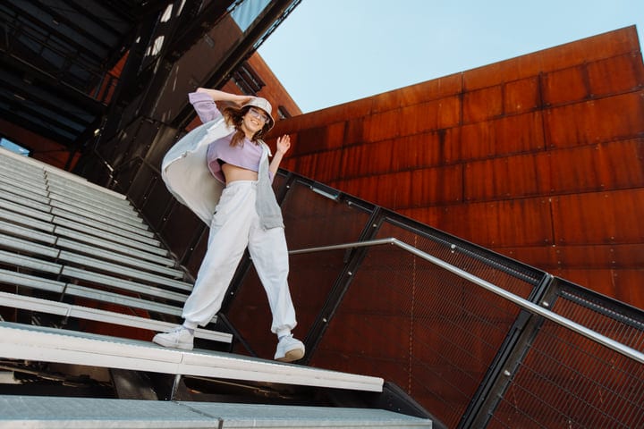 Energetic Dancer Embraces Freedom On Urban Staircase