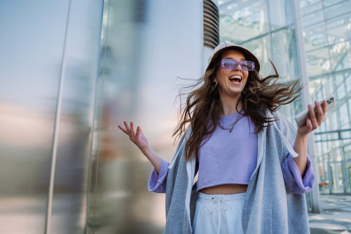 Energetic Street Dancer Radiates Joy in Urban Setting
