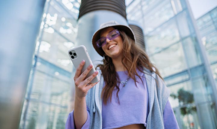 Urban Explorer Smiles While Checking Her Phone