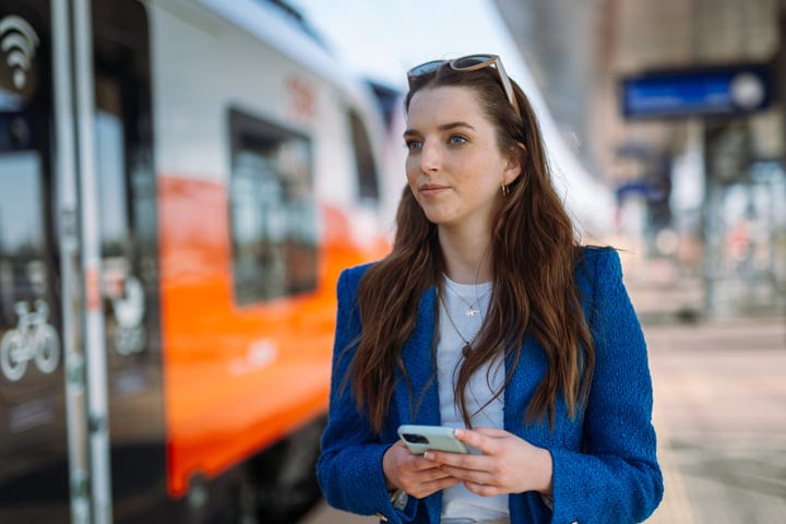 A Moment of Reflection on a Busy Urban Platform