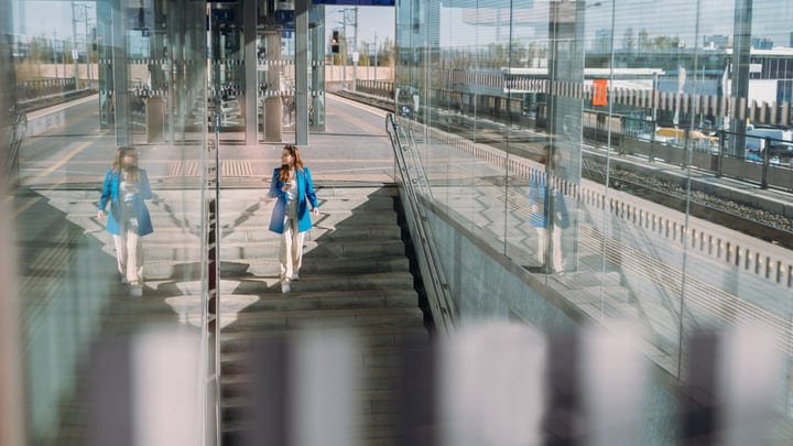 Reflective Journey Through a Modern Train Station