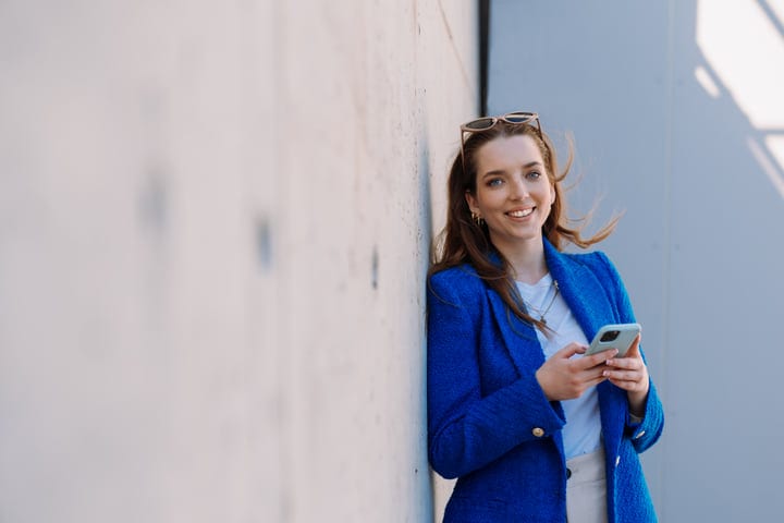 Urban Woman Embraces Connection with Digital Ease
