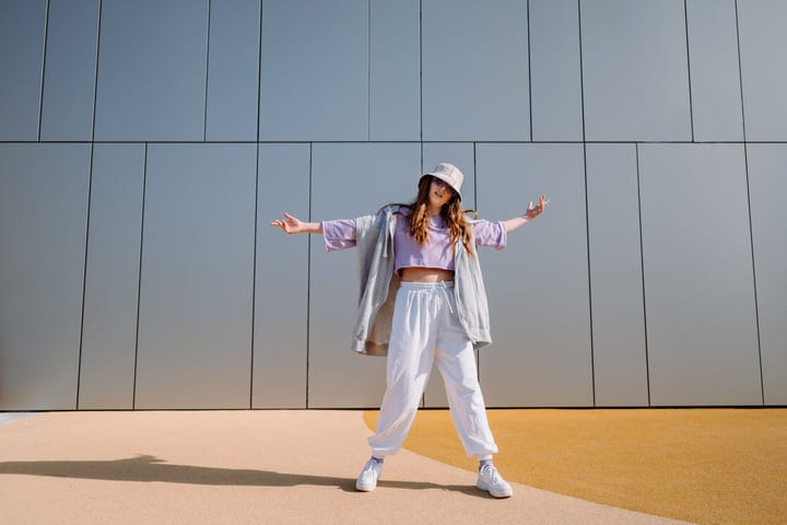 Graceful Street Dancer Embraces the Urban Sunlight