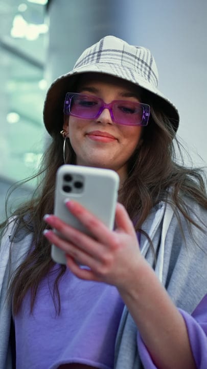 Young Woman Embracing Digital Connection Outdoors