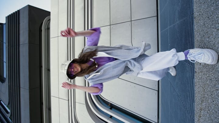 Joyful Street Dancer Energizes a Modern Urban Scene