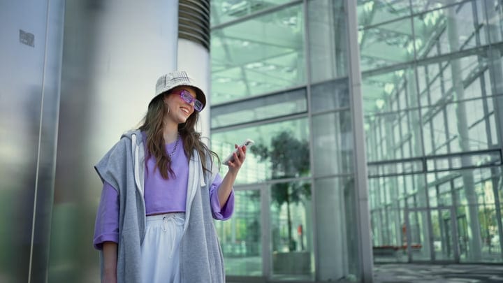 Young Woman Embraces Urban Style In Lively Street Scene