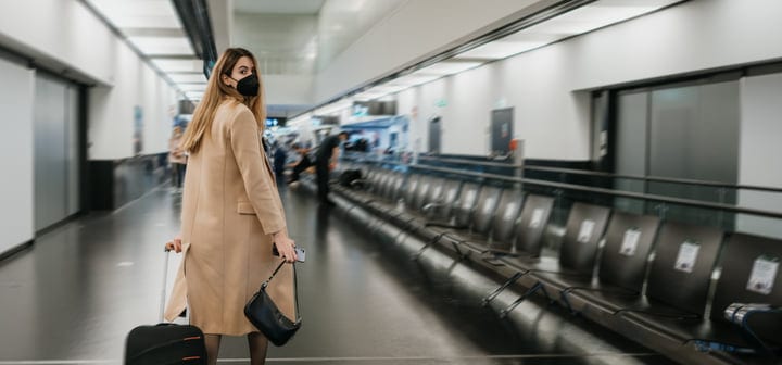 Traveler Navigates Quiet Airport Terminal With Poise