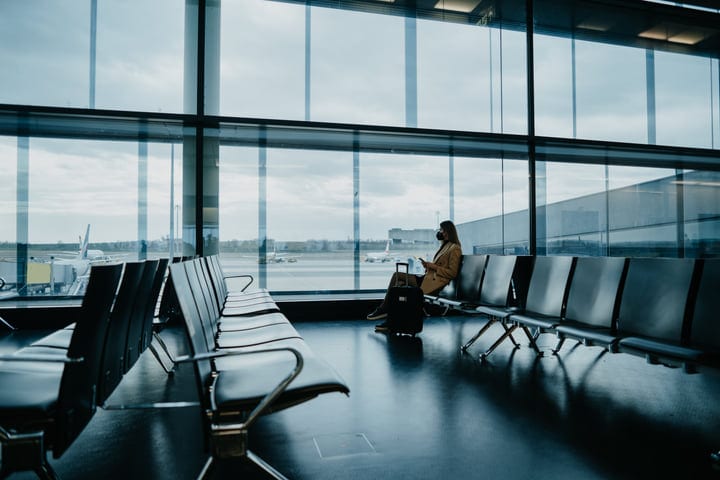 Solitary Traveler Waiting in a Quiet Airport Terminal